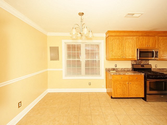 a kitchen with a stove and a microwave