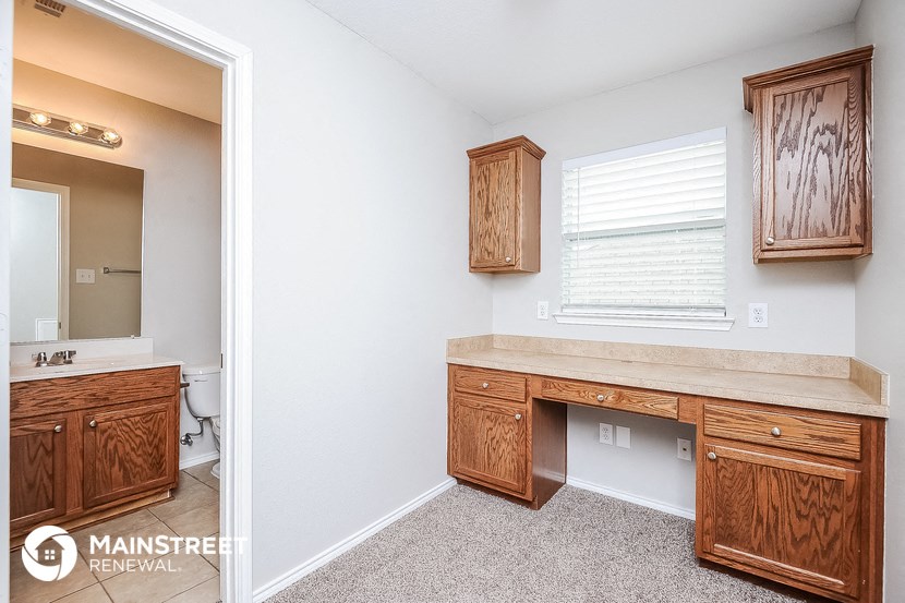 a bathroom with a vanity and a sink and a mirror