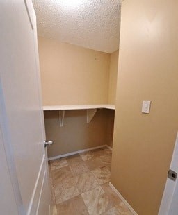 an empty bathroom with an open door