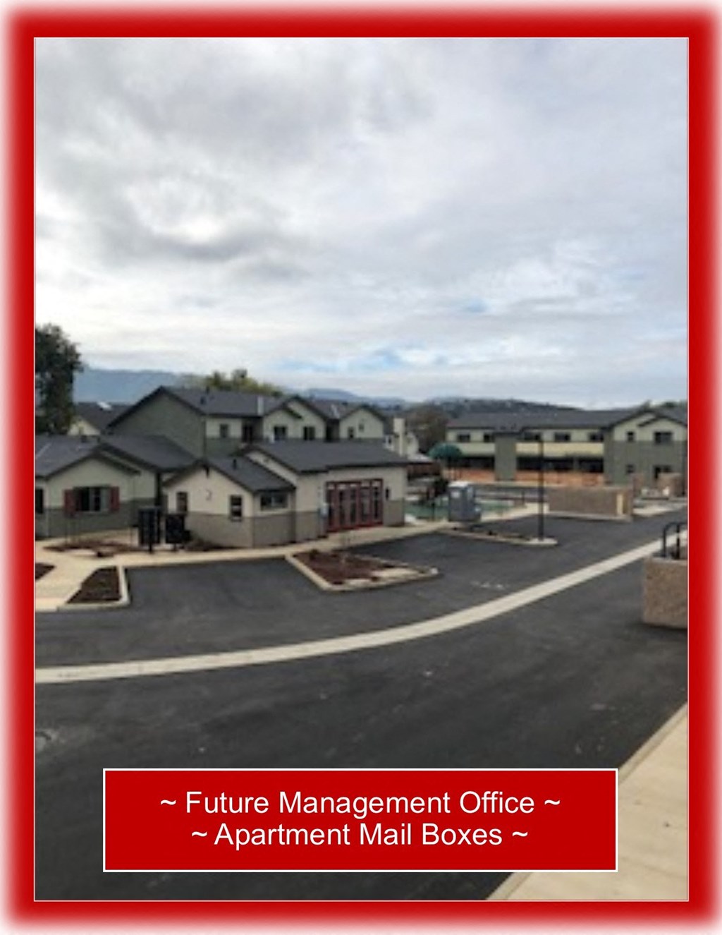 a picture of a street with houses in the background