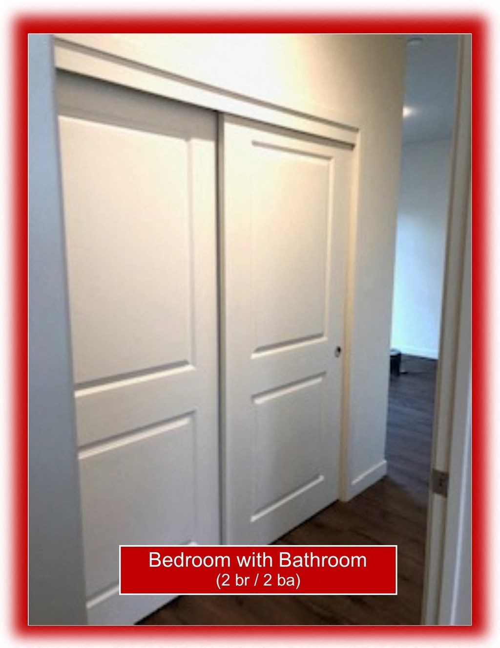 a pair of white closet doors in a room with a wood floor