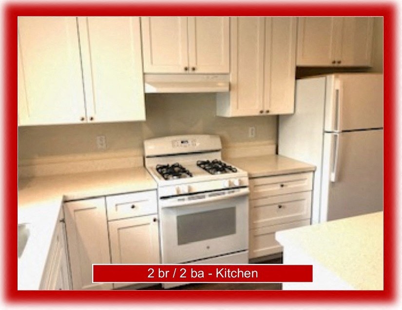 a kitchen with a stove and a refrigerator