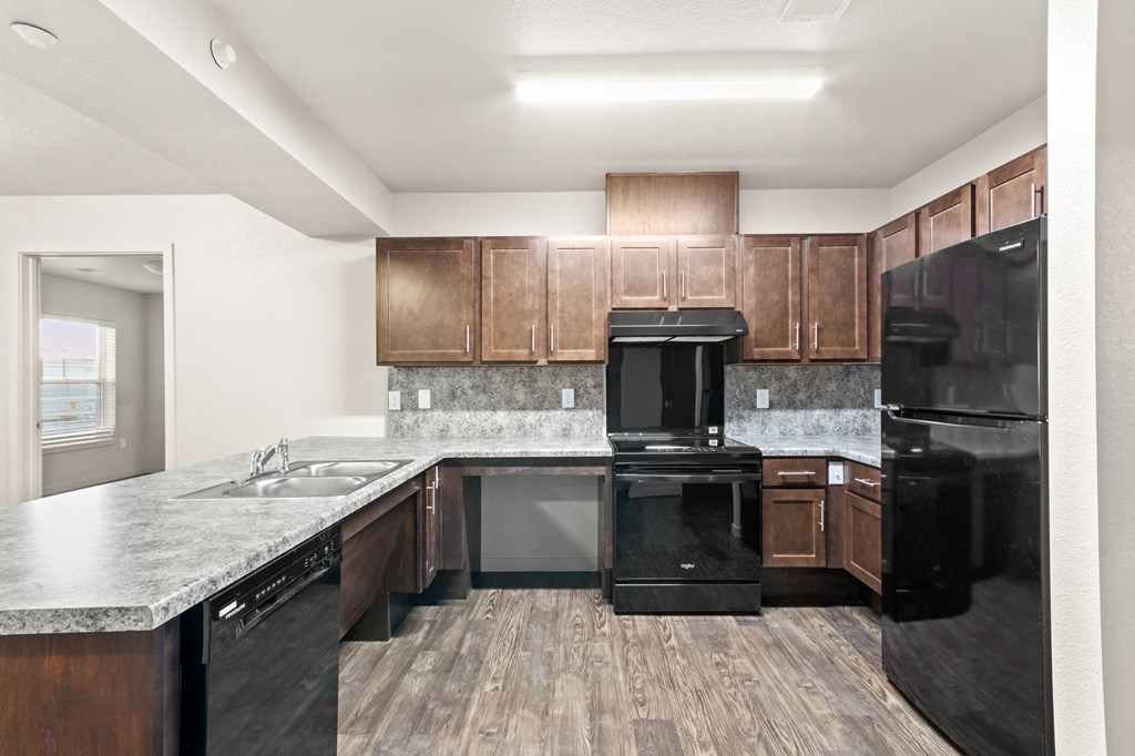 the preserve at ballantyne commons apartment kitchen with black appliances