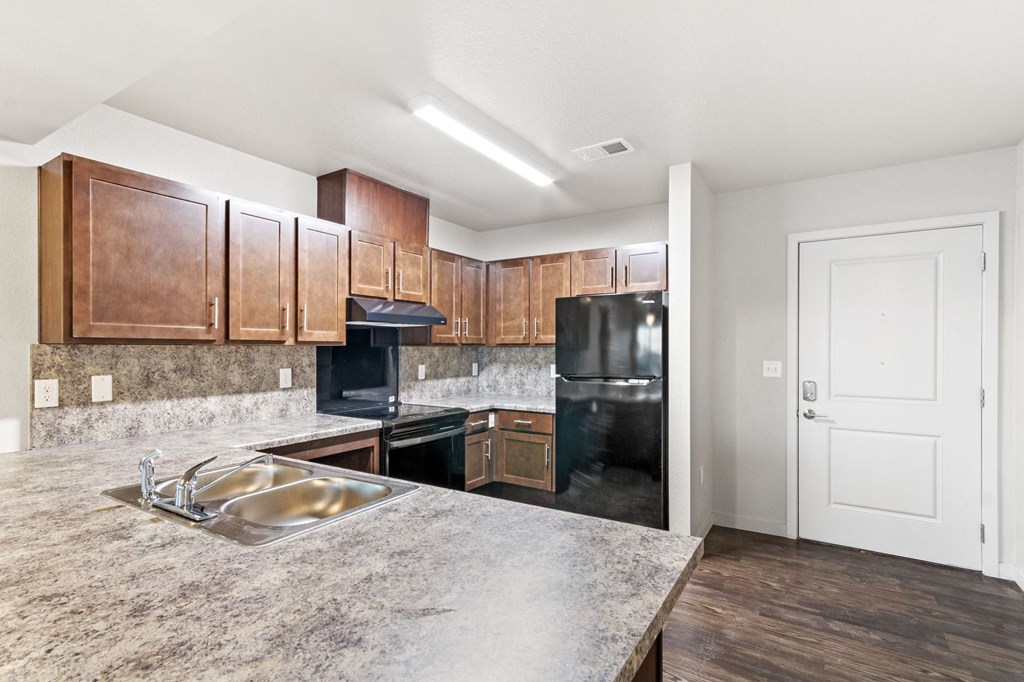 the preserve at ballantyne commons apartment kitchen with black appliances