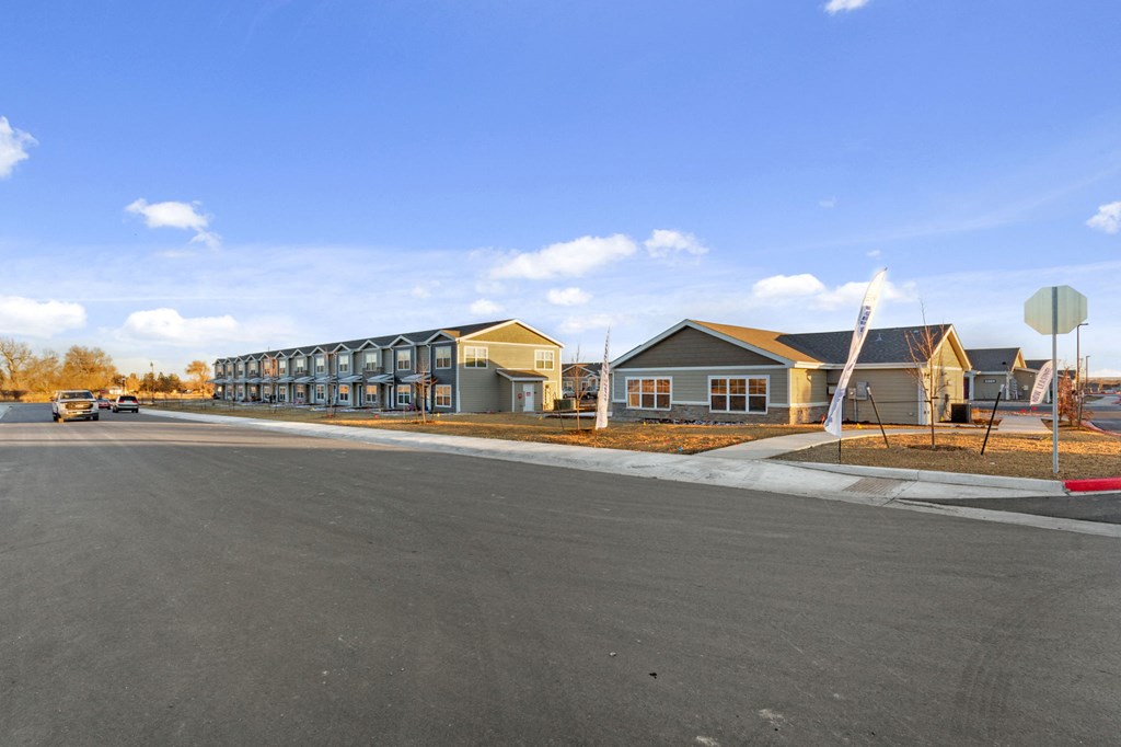 a row of houses on the side of a street