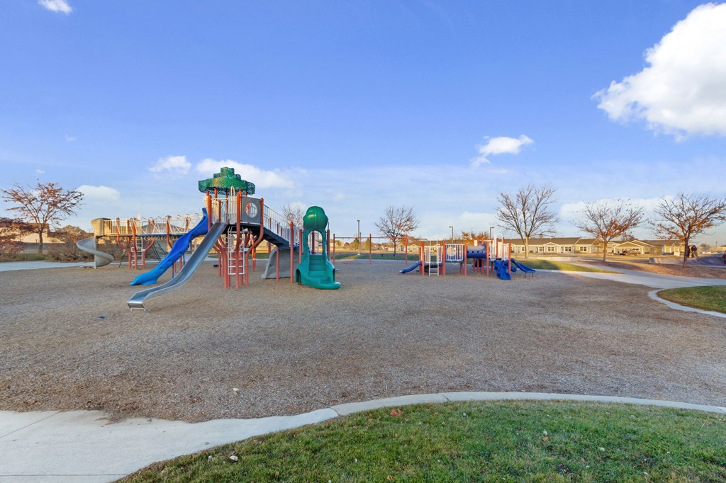 a playground at a park with slides and other playground equipment