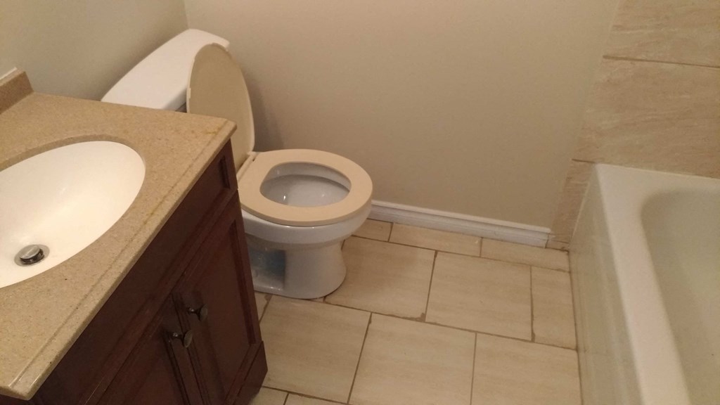 a bathroom with a toilet and a sink