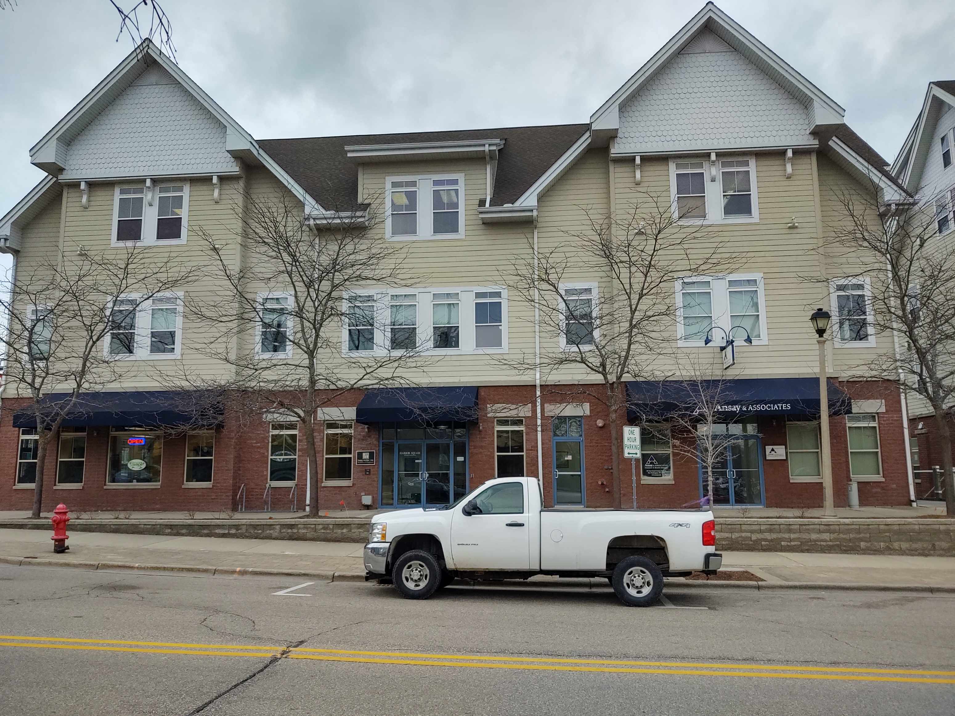 a white truck parked in front of a building
