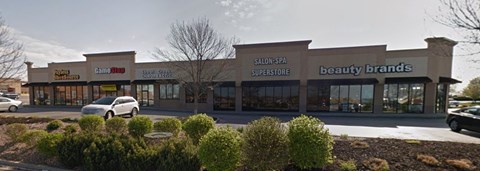 A storefront with a sign that reads "beauty brands.".