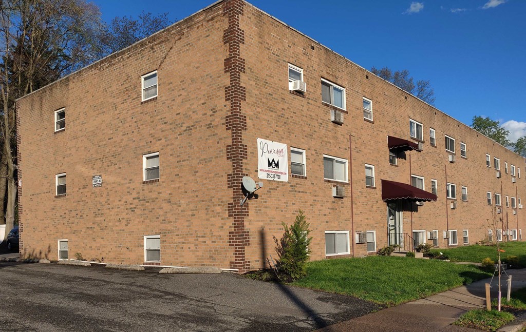 a brick building with a sign on the side of it