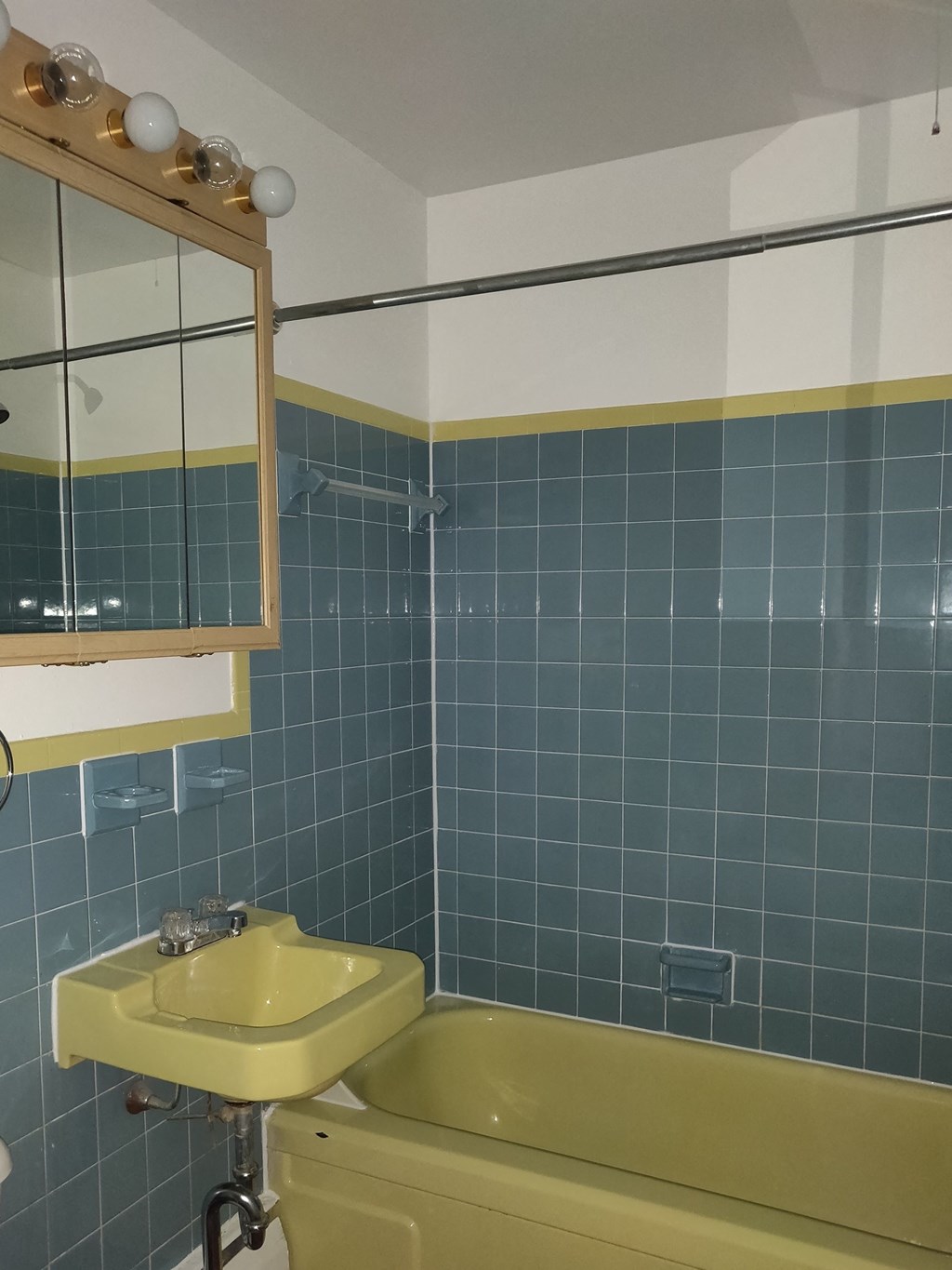 a bathroom with a sink and a bath tub