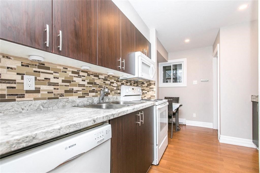 a kitchen with a sink and a counter top