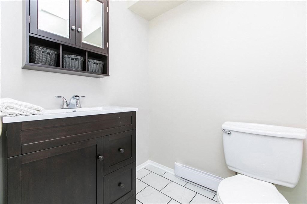 a bathroom with a toilet and a sink