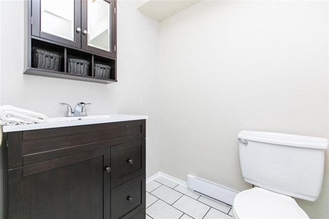 a bathroom with a toilet and a sink