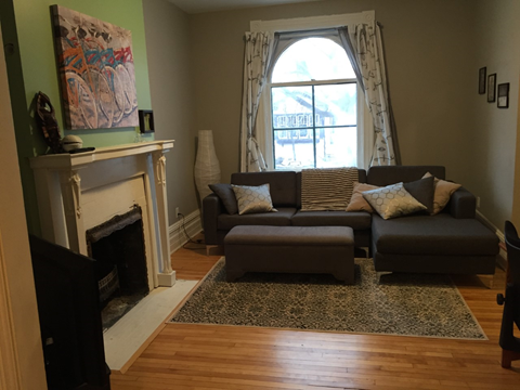 a living room with a couch and a fireplace