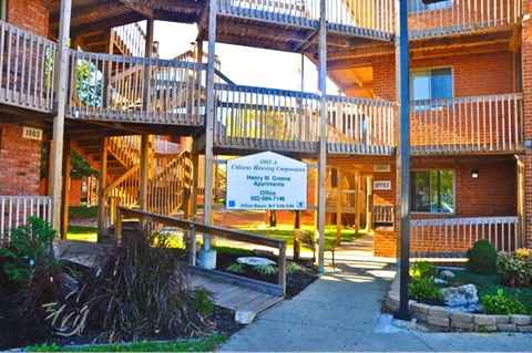 a view of the outside of a building with a sign