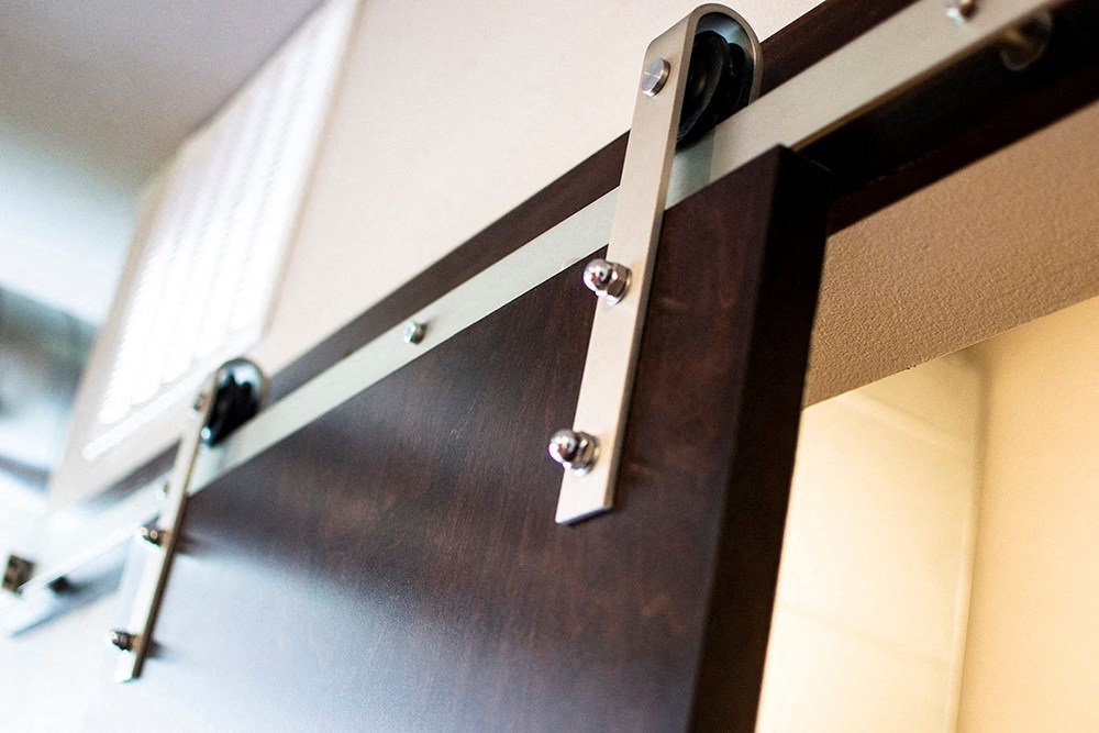 a sliding glass door with hardware on it