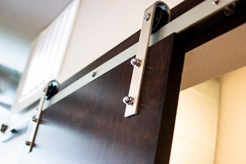 a sliding glass door with hardware on it