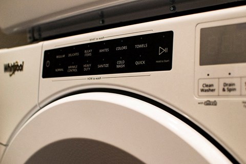 a white washing machine with the door open