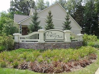 a white fence in front of a house