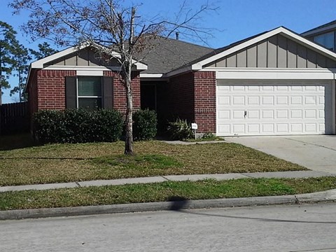 a house with a white garage door in front of it