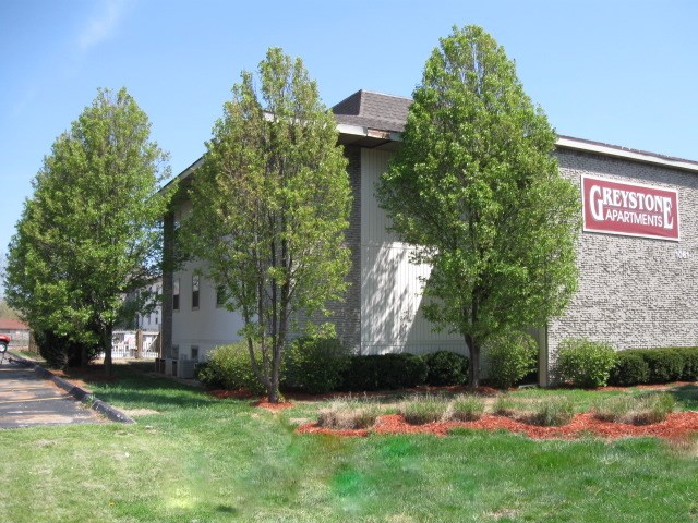 a church building with a sign on the side of it