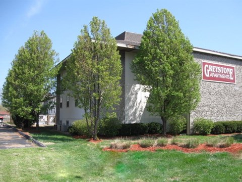 a church building with a sign on the side of it