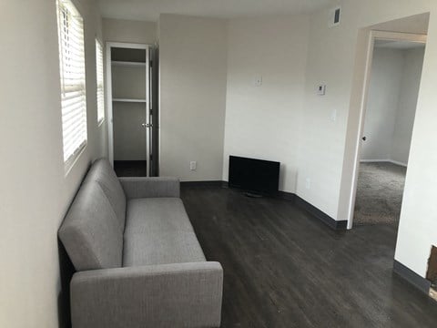 a living room with a couch and a tv