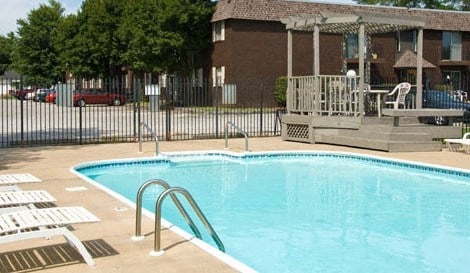 a swimming pool in front of a house