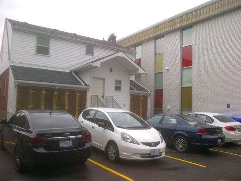 Three cars parked in a parking lot.