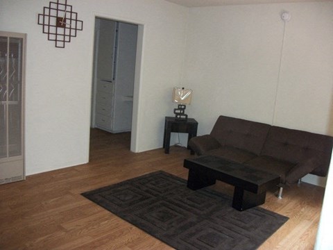 a living room with a couch and a table