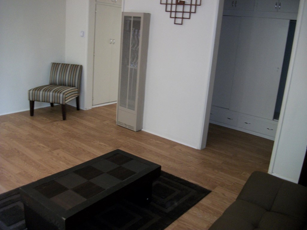 a living room with a couch and a chair