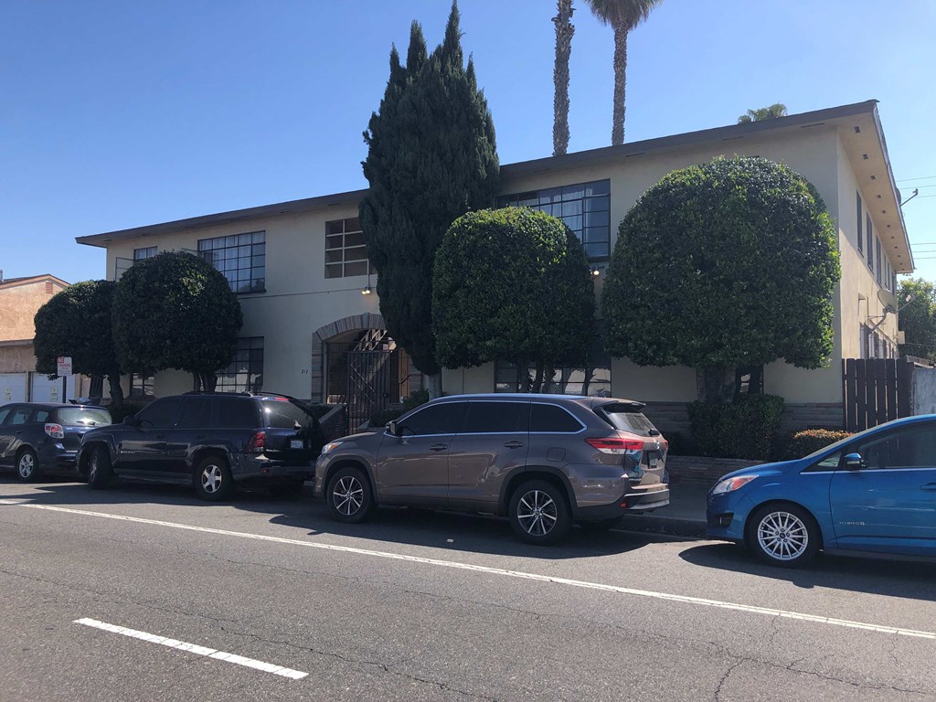 a building with cars parked in front of it