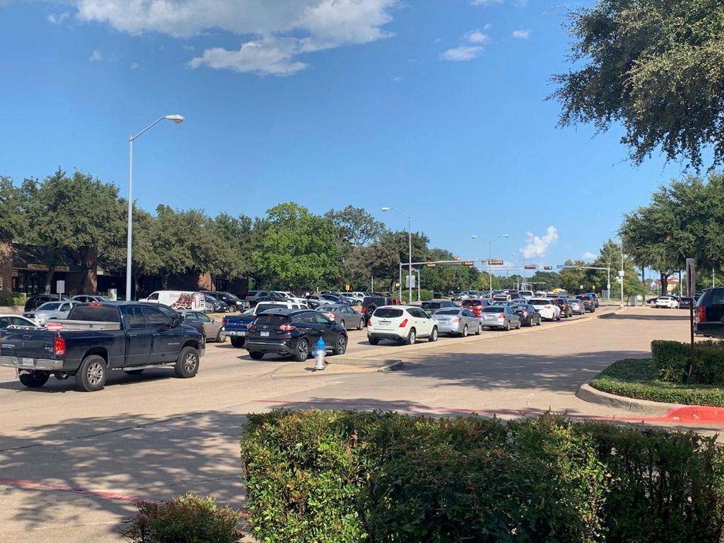 a parking lot filled with cars and a fire hydrant
