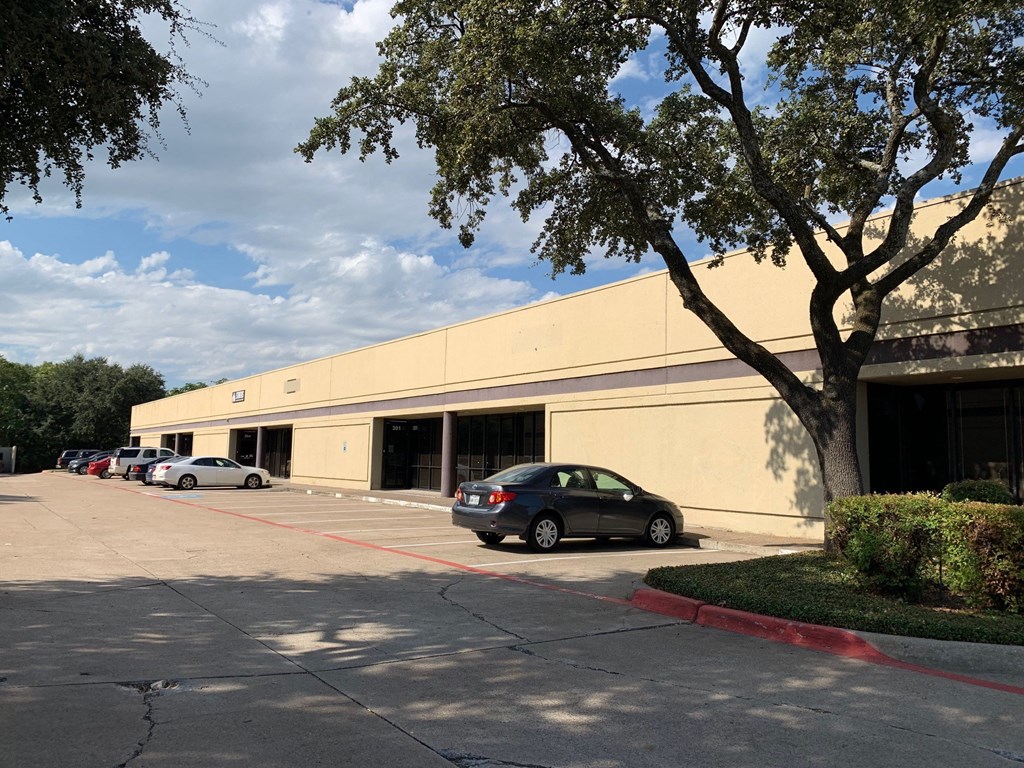 a building with cars parked in front of it