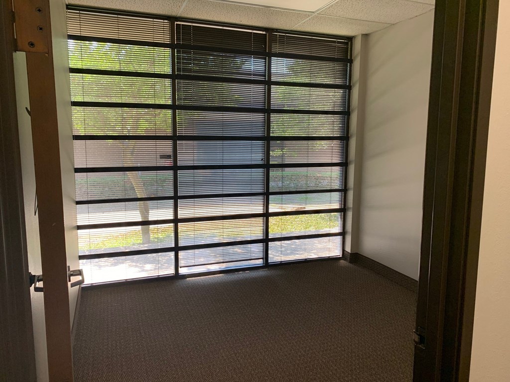 a room with a view of a window and a door