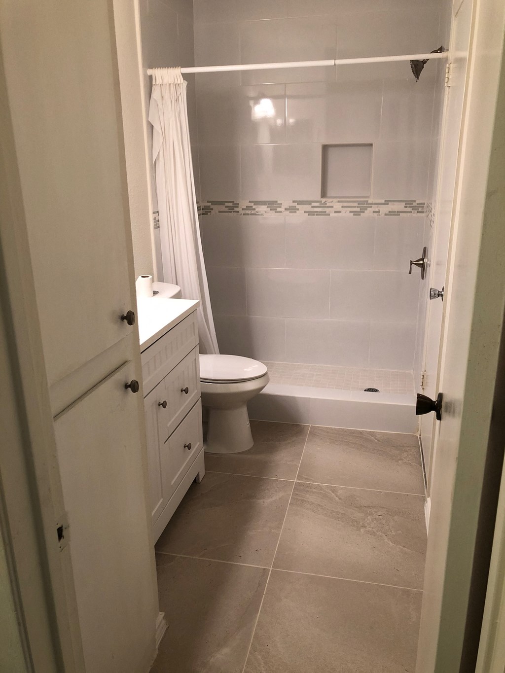 a small bathroom with a toilet and a shower