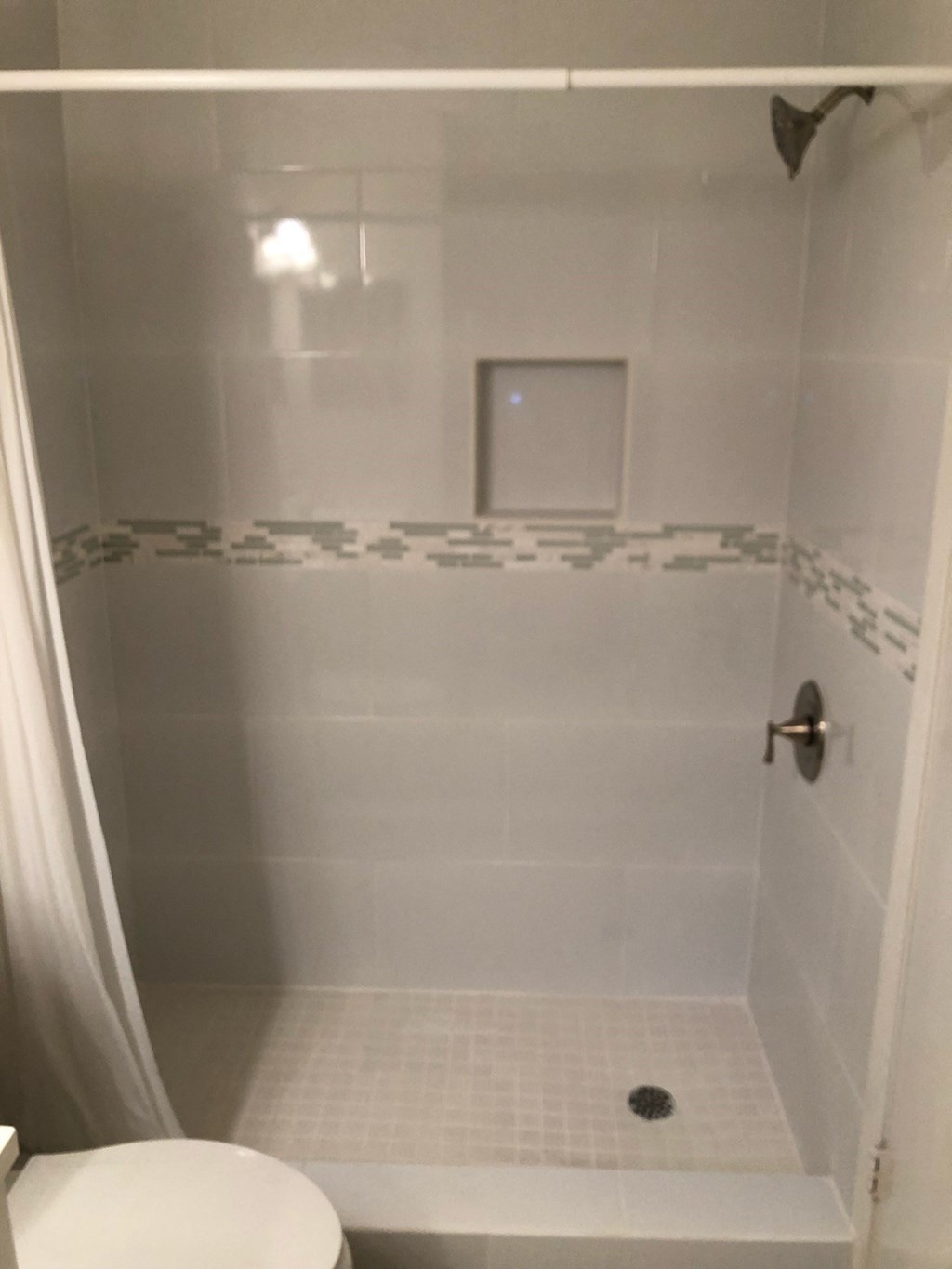 the shower has been cleaned and is ready to be remodeled