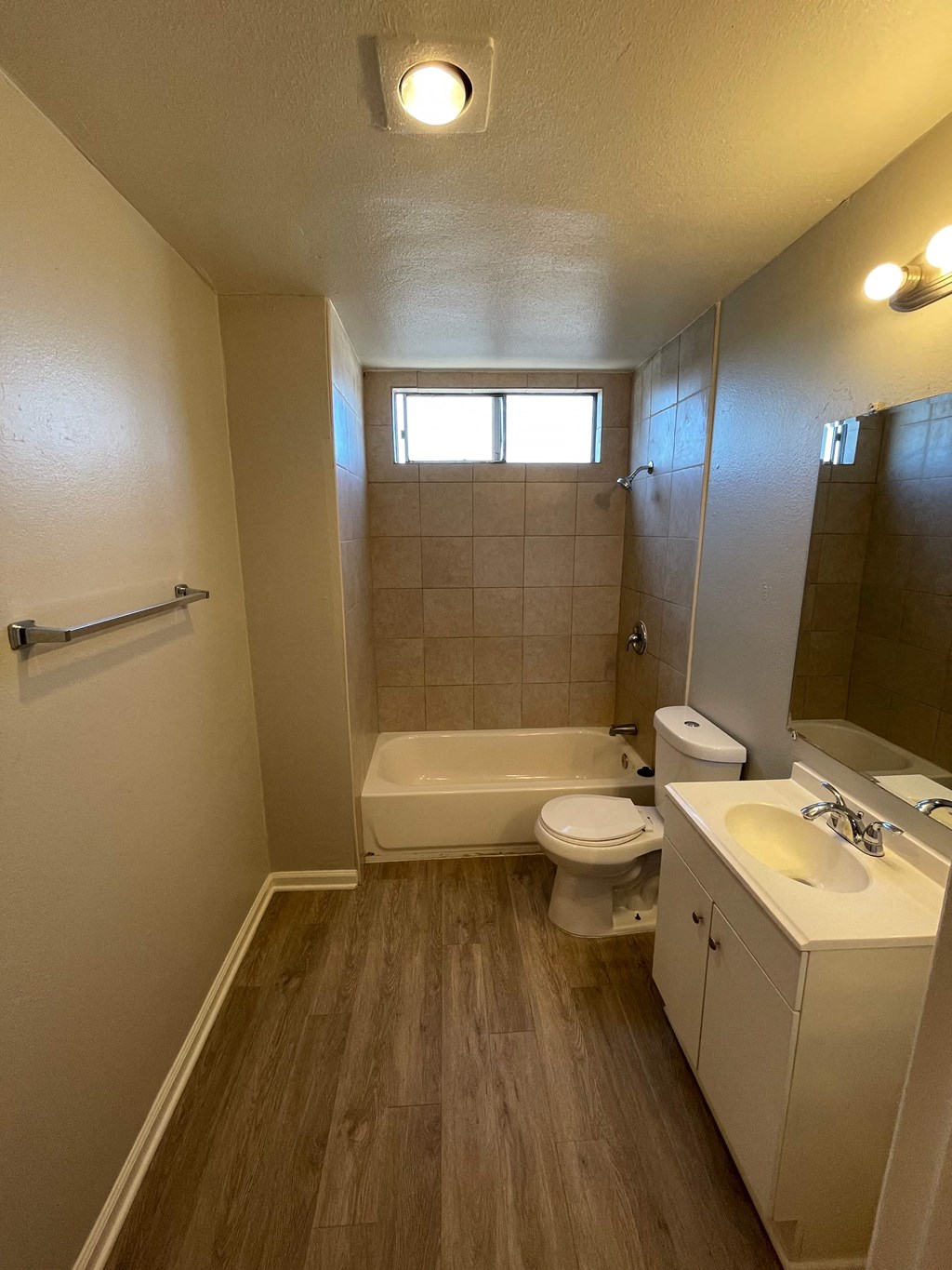 a bathroom with a toilet sink and a tub