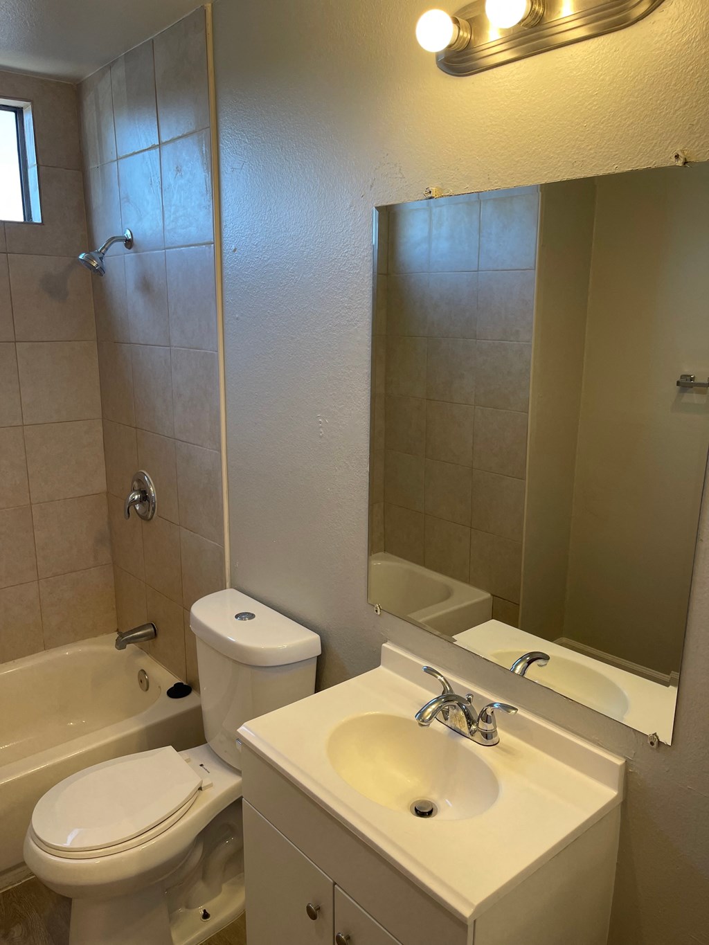 a bathroom with a sink toilet and a shower