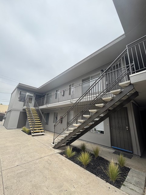 A modern house with a staircase leading to the second floor.