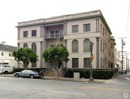 a large building on the corner of a city street