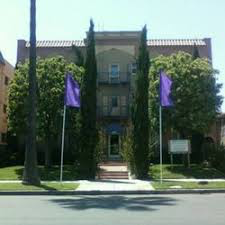 a building with purple flags in front of it