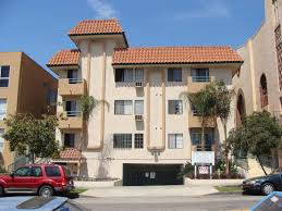 a building with a red truck parked in front of it