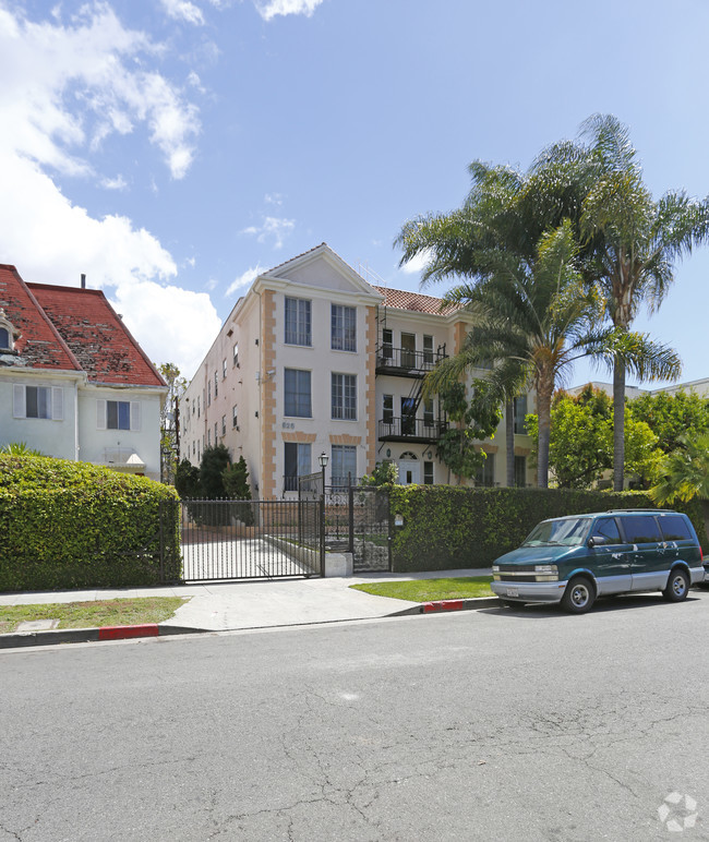 a van parked in front of an apartment building