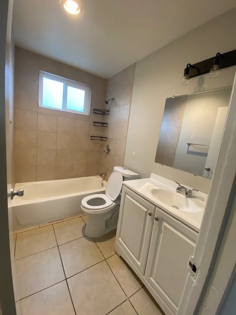 A white bathroom with a toilet, sink, and bathtub.