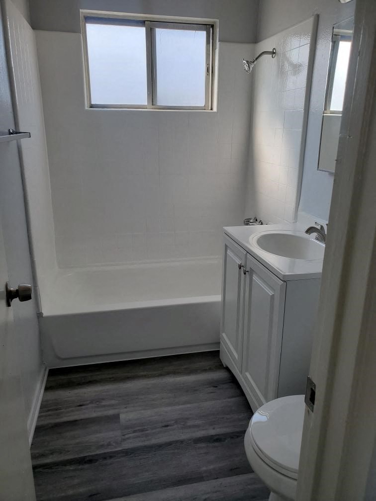 a bathroom with a sink toilet and a bath tub