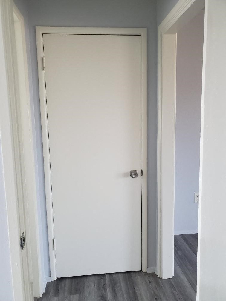 a white door with a silver door knob