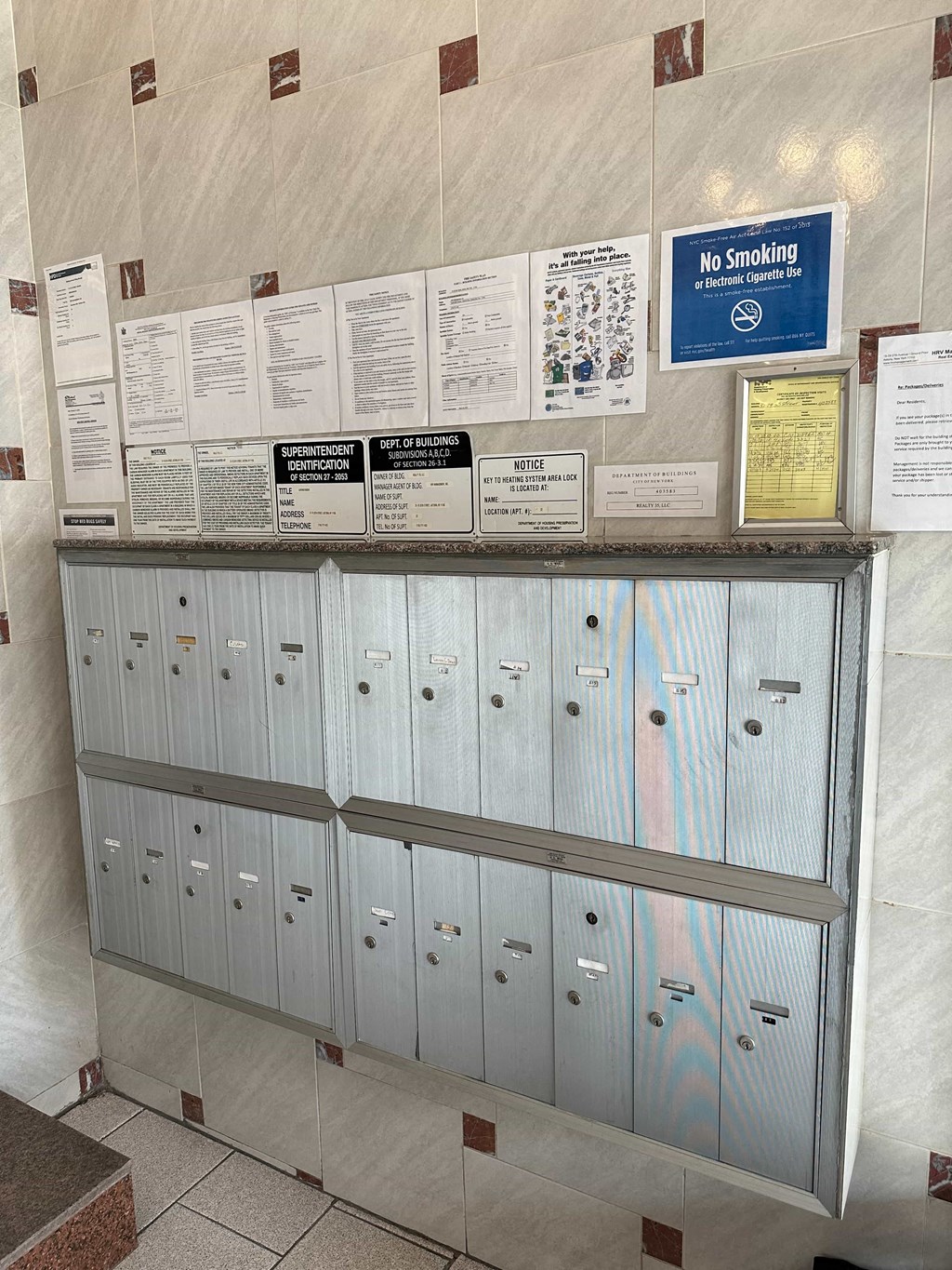 a row of lockers in a building with cards on them