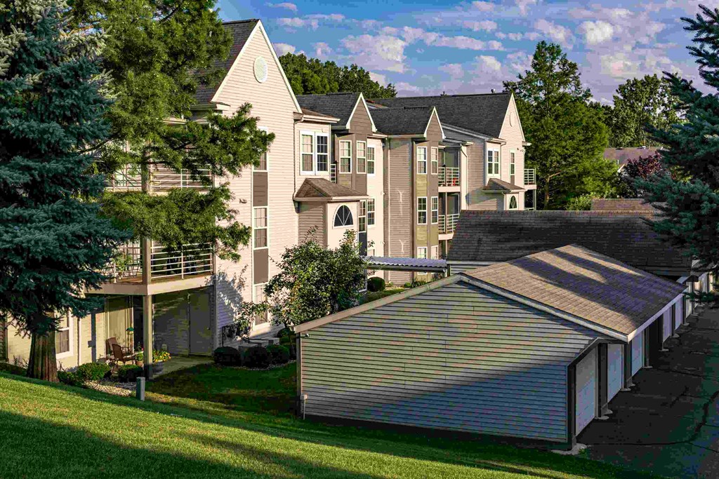 an aerial view of a large apartment building with a garage
